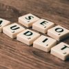 pexels photo 267415 267415 Scrabble tiles spelling SEO Audit on wooden surface, symbolizing digital marketing strategies.